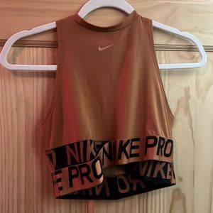 Burnt orange colored size medium sports bra/cropped athletic top